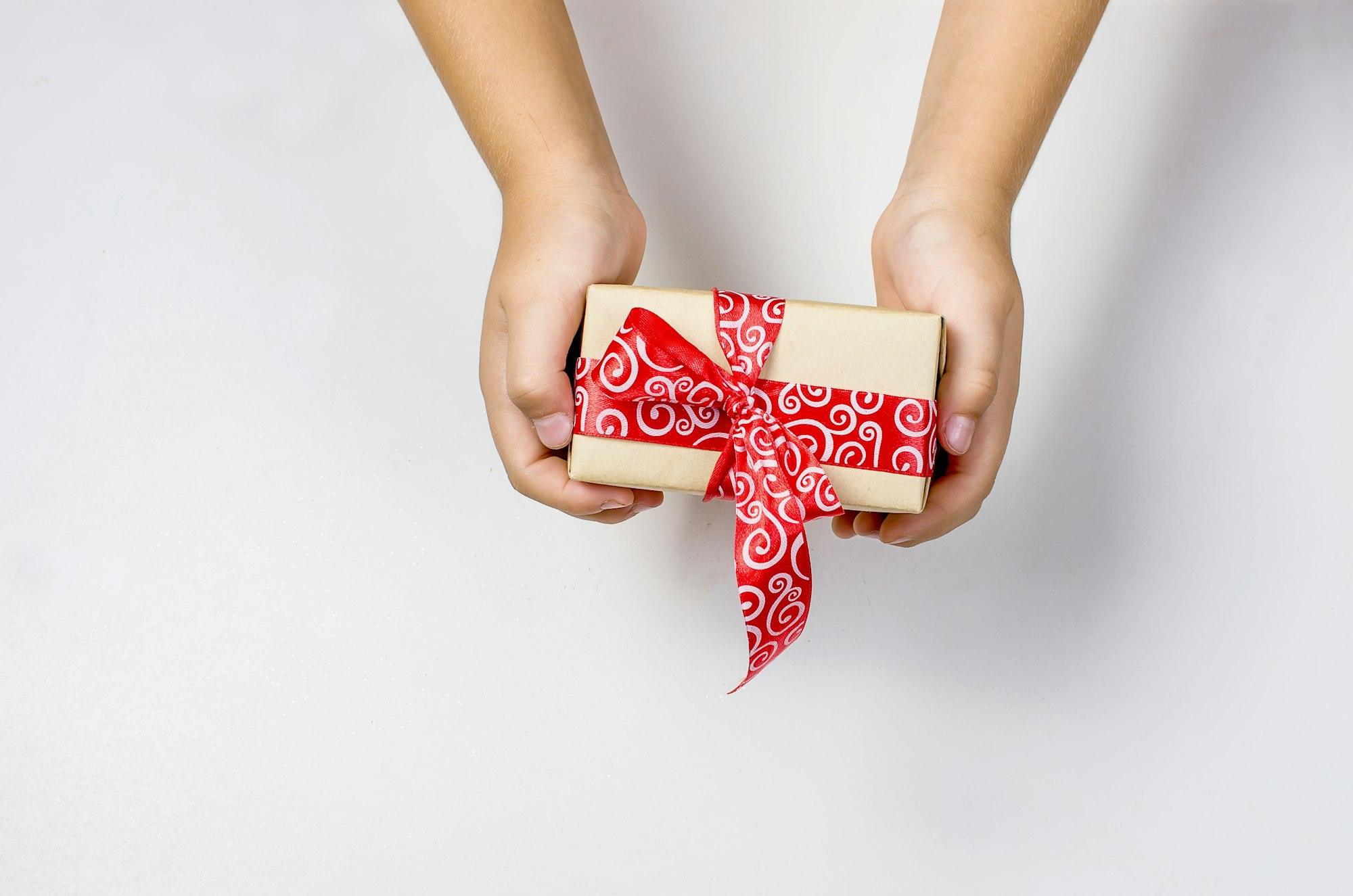 baby packs a handmade gift. Christmas gifts,