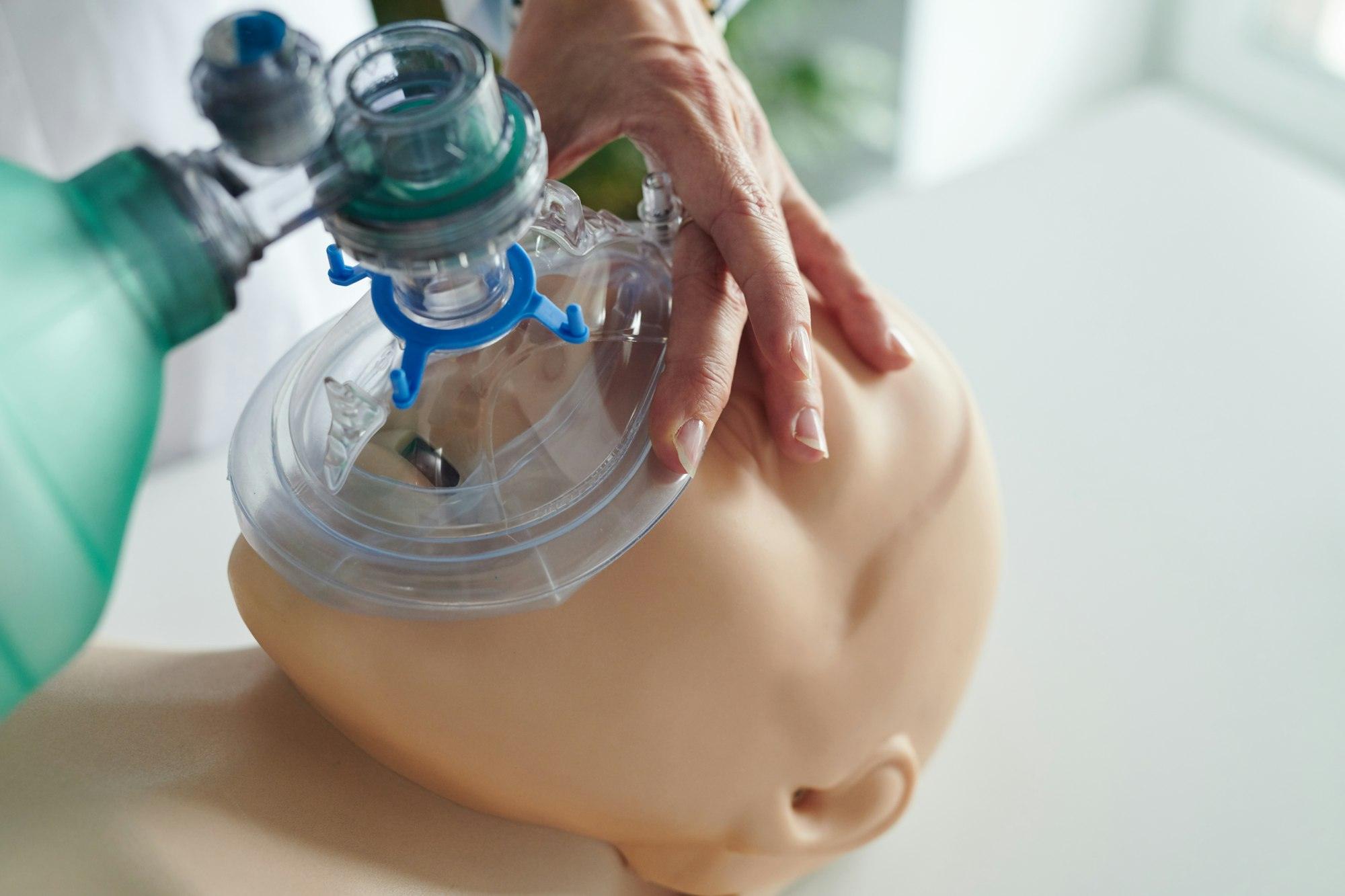 Nurse learning to use oxygen mask