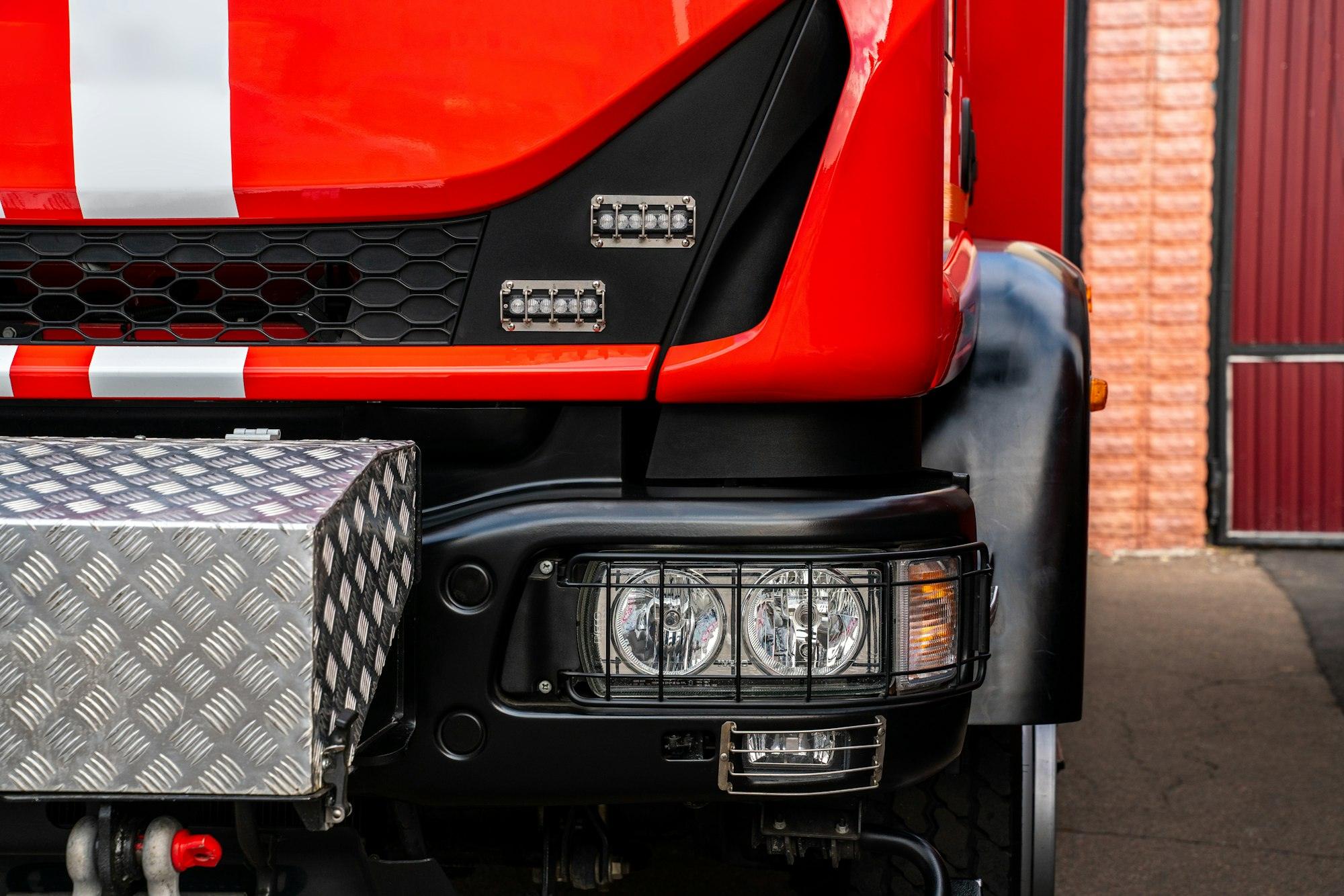 Red fire truck. Cropped view of the firefighting technological transport.